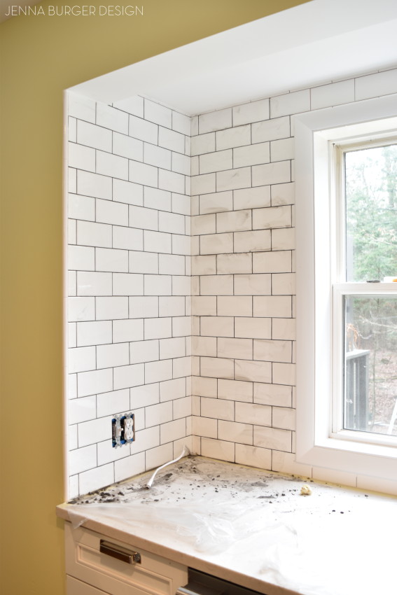 How do you choose the perfect kitchen tile backsplash? There are so many decisions. These are 12 ideal options for the kitchen backsplash and ONE is what I chose for my kitchen renovation. Click over to check them out + follow along on how I installed the tile > www.JennaBurger.com